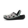 Black women's platform sandals with rhinestone detailing and a hole shoe design on an EVA sole.