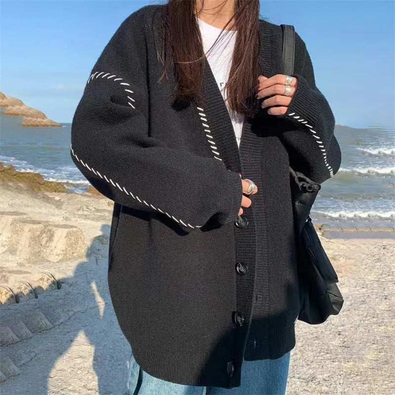 Women's loose fit long sleeve knitted cardigan coat in black or white