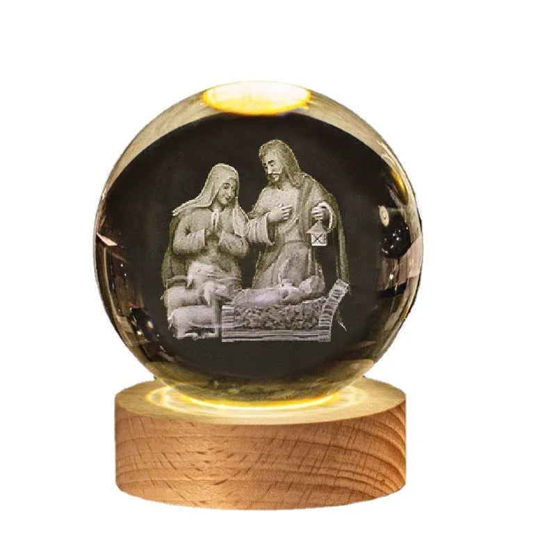 White crystal ball ornament on wooden base with religious symbols and warm light illumination