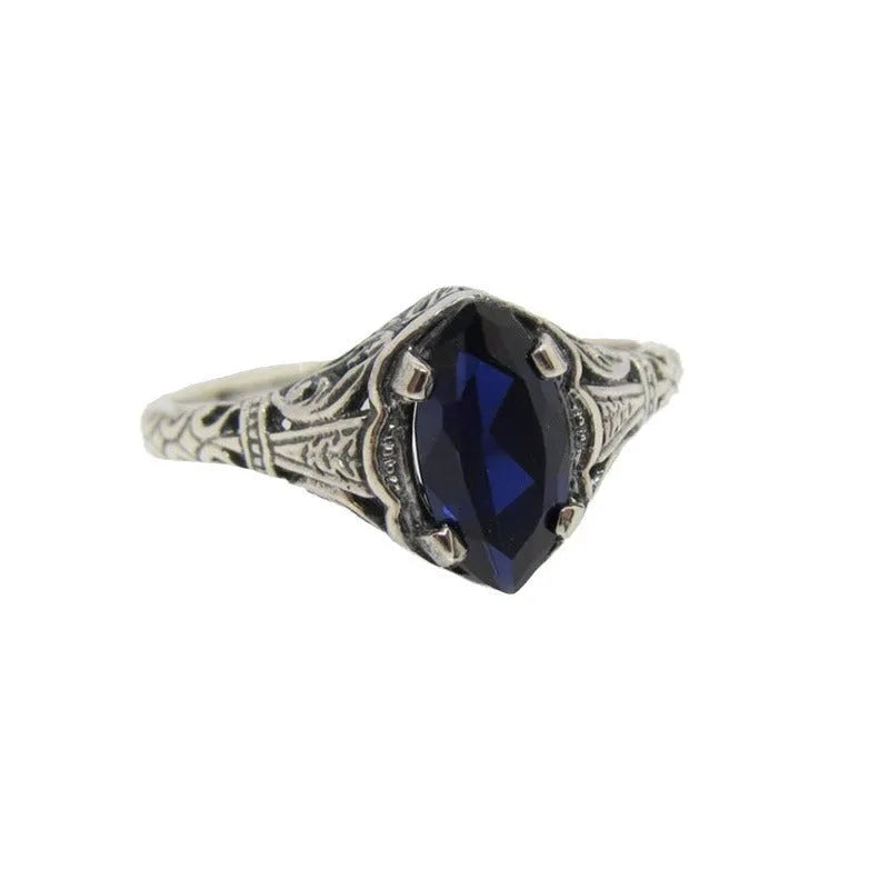 Women's silver alloy ring with geometric hollow pattern and zircon detailing