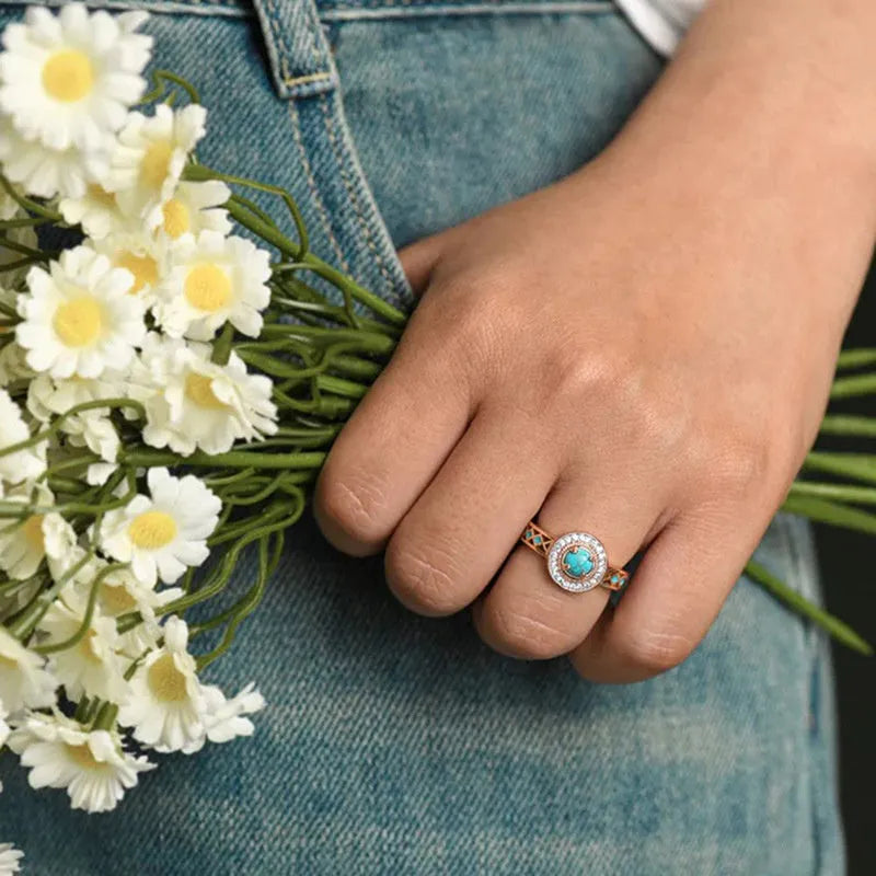 Women's turquoise geometric ring with micro-inlaid zircon on rose gold copper band.