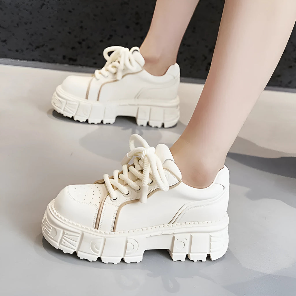 Women's beige casual leather shoes with a spring muffin heel on a rubber foam sole.
