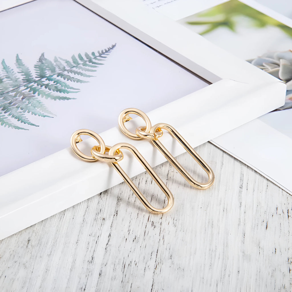 Sterling silver geometric hoop earrings with ring and line design elements