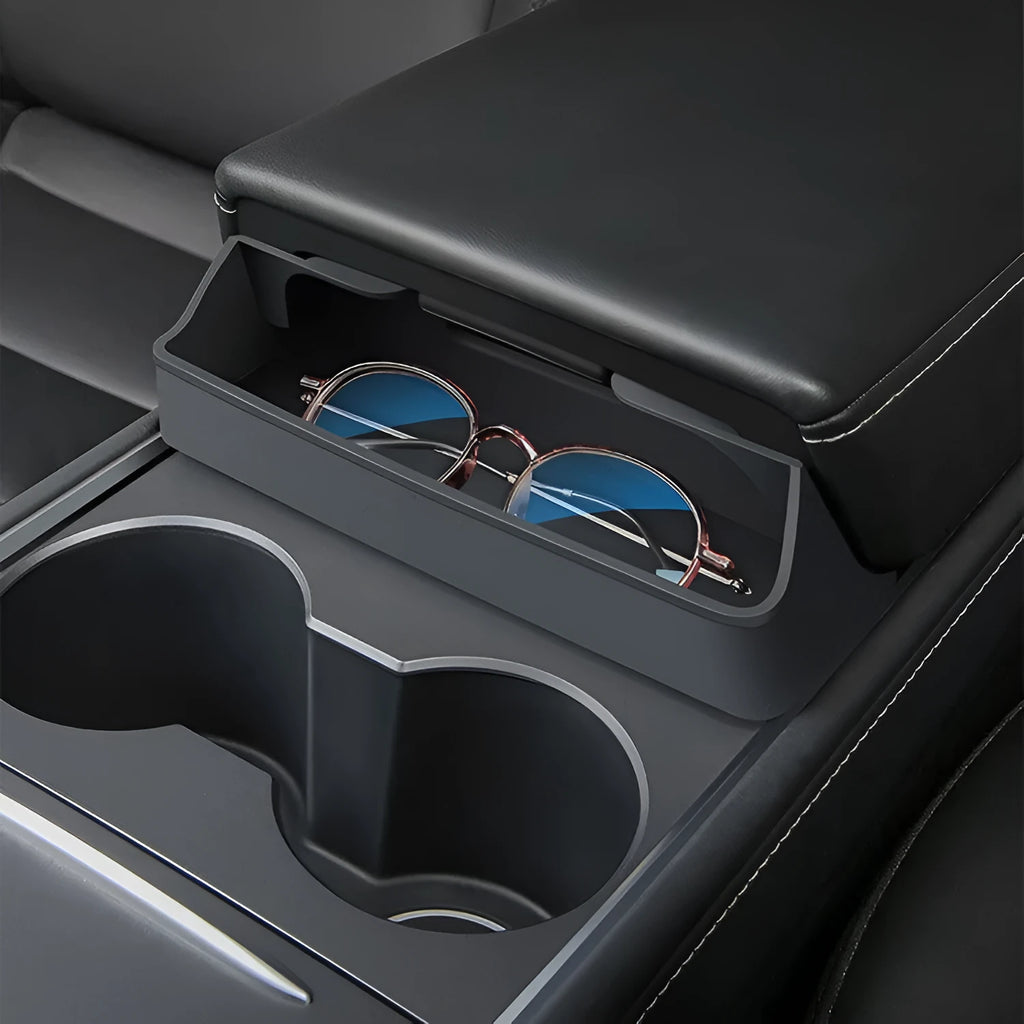 Black silicone glasses case mounted in Tesla Model 3 or Y armrest compartment for organised storage