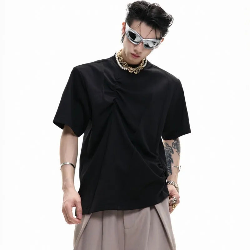 Men's grey loose-fit cotton t-shirt with three-dimensional pleats and a round neck.
