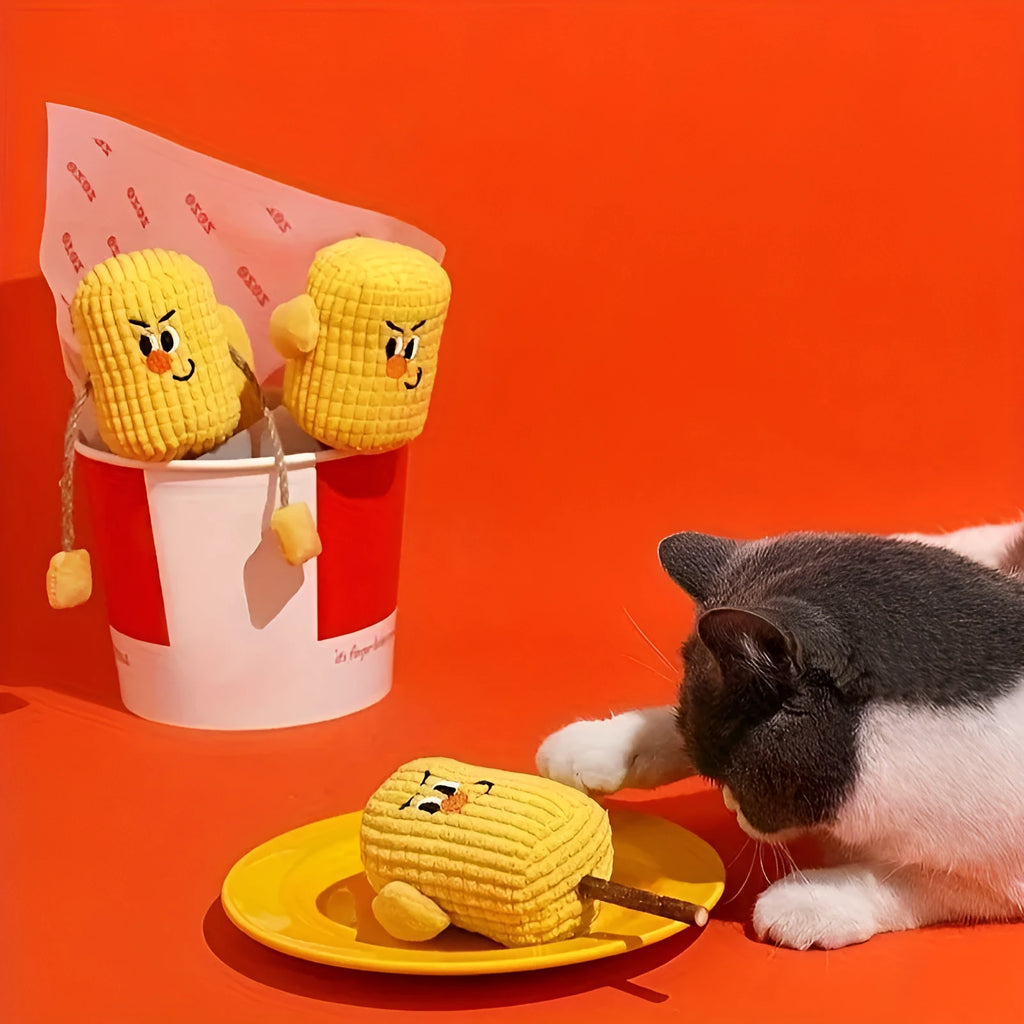 Corn cob shaped cat toy made from natural polio wood on a white background.