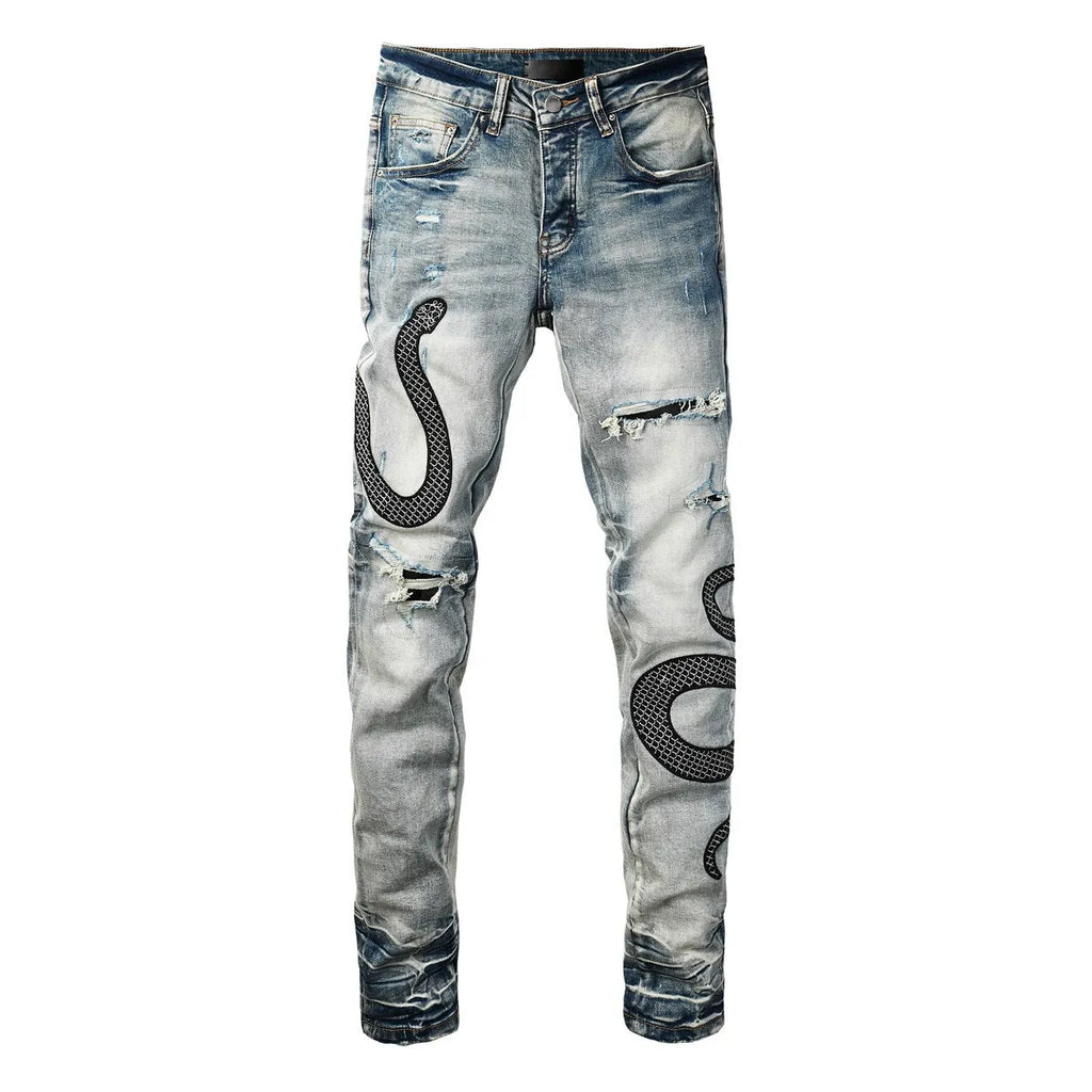 Distressed blue skinny jeans with wash detailing and button fly on mid waist design