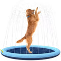 Blue anti-slip dog splash pad mat with sprinkler jets, set up on a garden lawn.