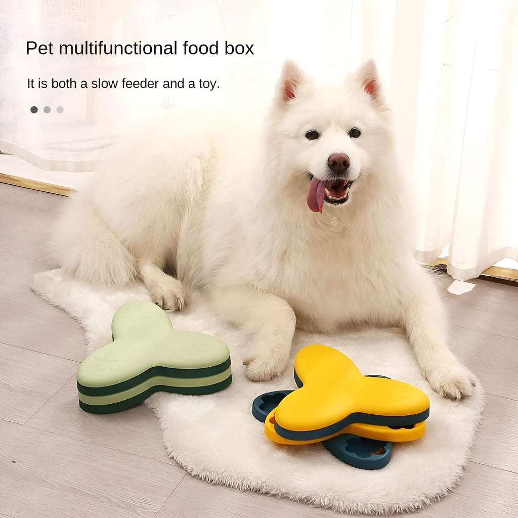 Green and yellow dog puzzle toy with rotatable treat dispenser and nine bone-shaped compartment covers