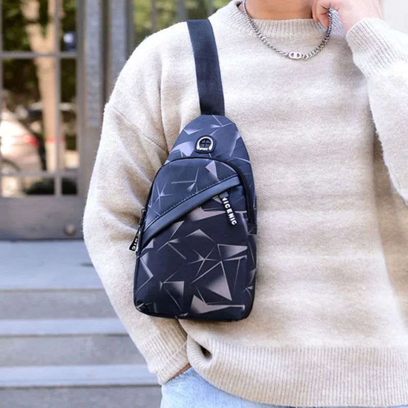 Blue print sling chest crossbody bag for men with an earphone hole and zipper opening.