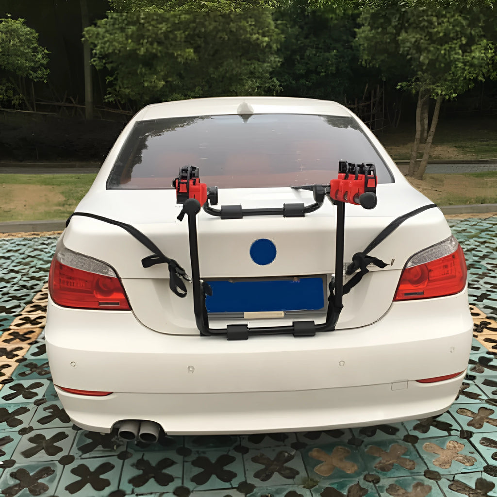 Black and red trunk mounted car bike holder rack with iron frame.
