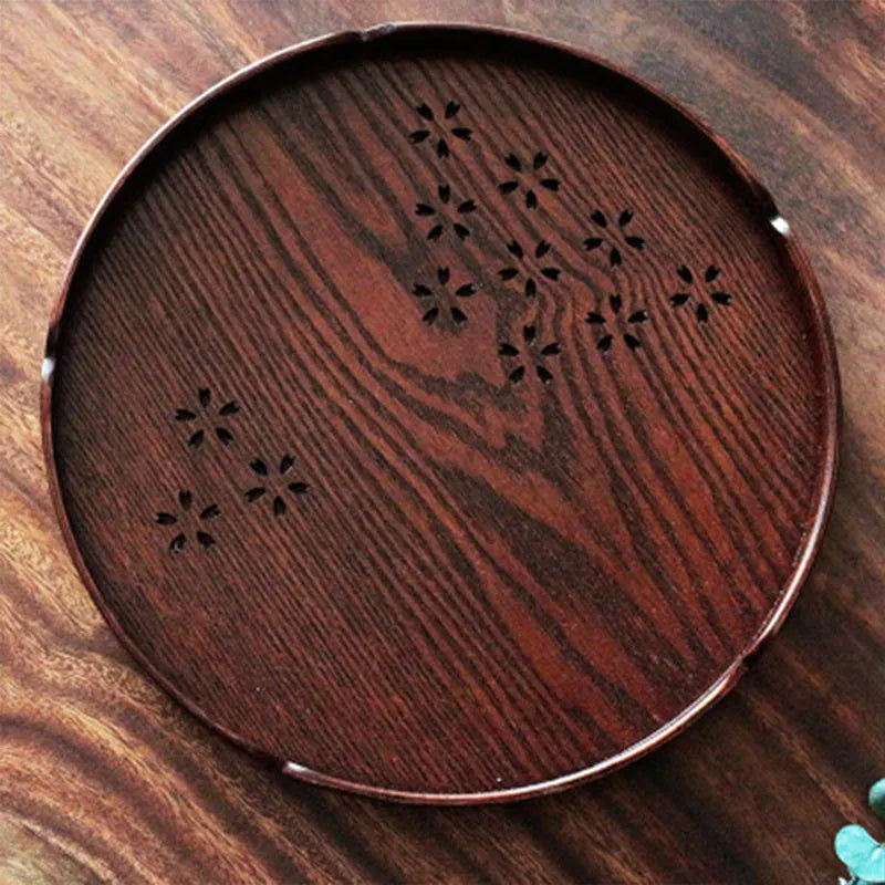 Wooden shallow plate with hollow cherry blossom design, 30cm diameter.