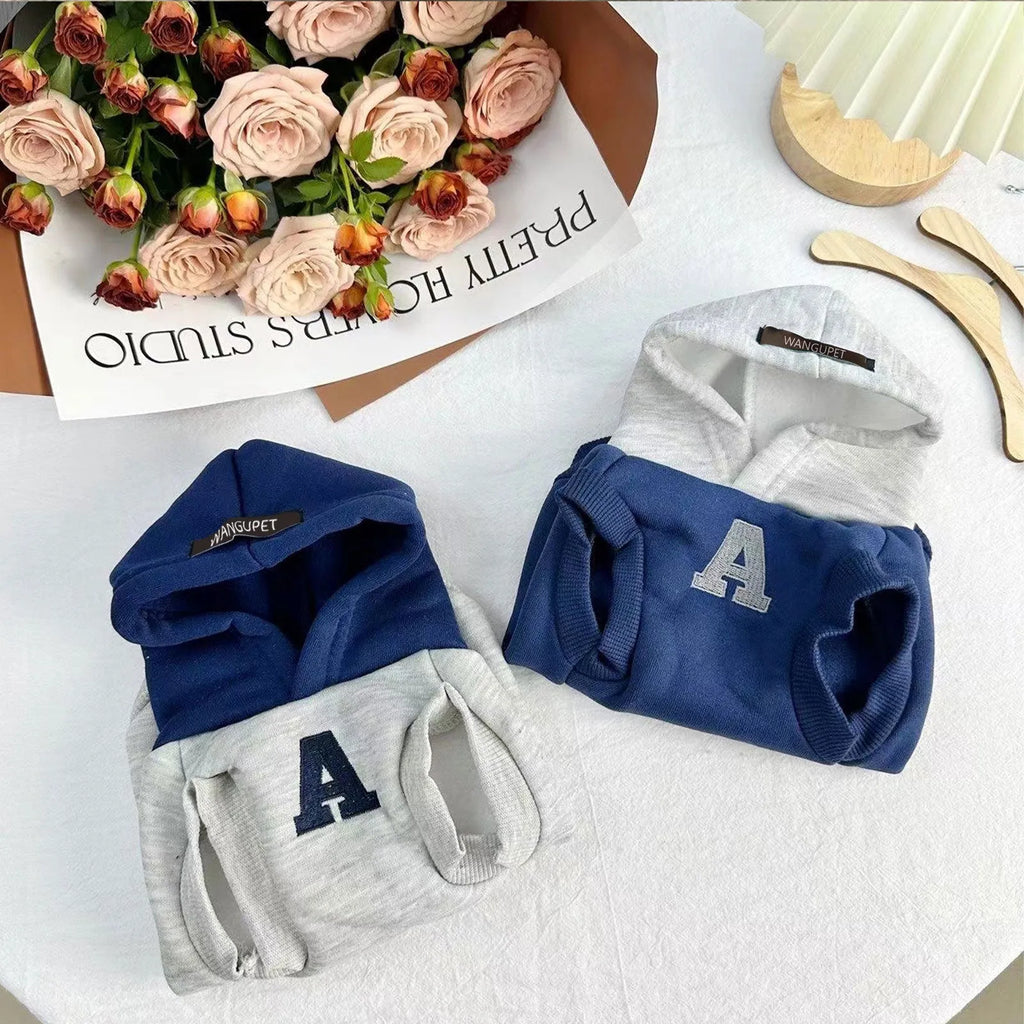 Blue polyester pet hoodie for dogs or cats with reflective white letters, slim-fitting design.