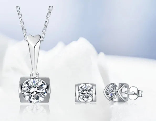 S925 sterling silver moissanite pendant necklace and stud earrings two-piece set on white background