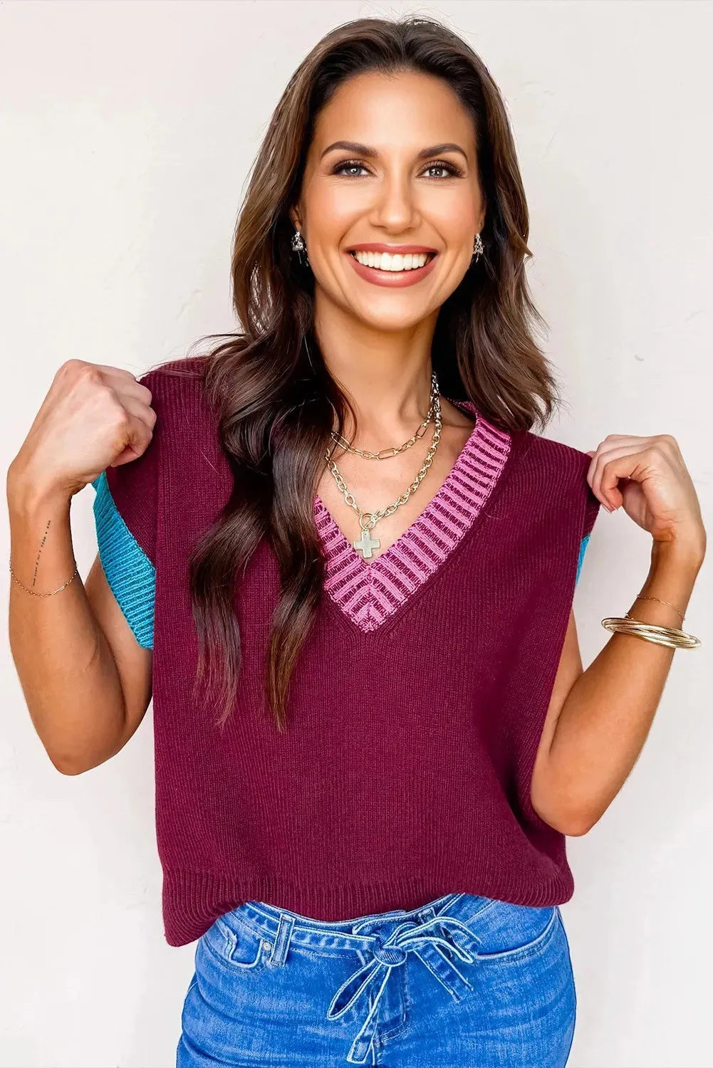 Burgundy loose sweater with contrast trim, V-neck, and cuffed short sleeves.