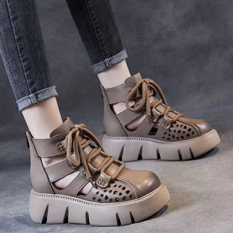 Women's black platform sandals with fish mouth toe and plush leather upper on a neutral background.
