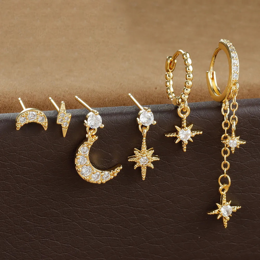 Set of six gold-colour chain tassel earrings with zircon studs, shown arranged together.