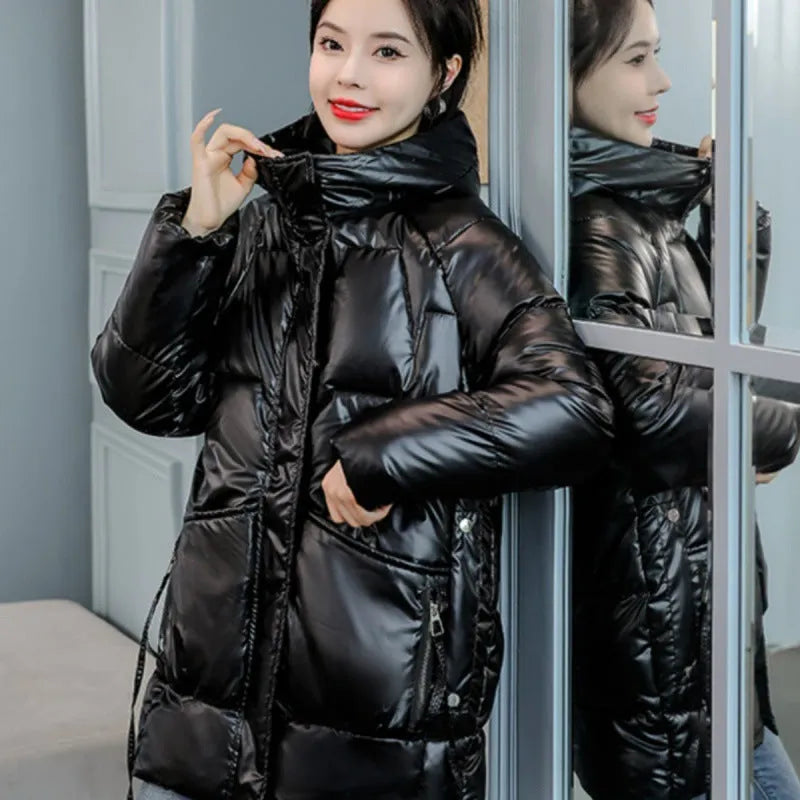 Women's loose thick hooded winter jacket in acrylic fabric on a hanger