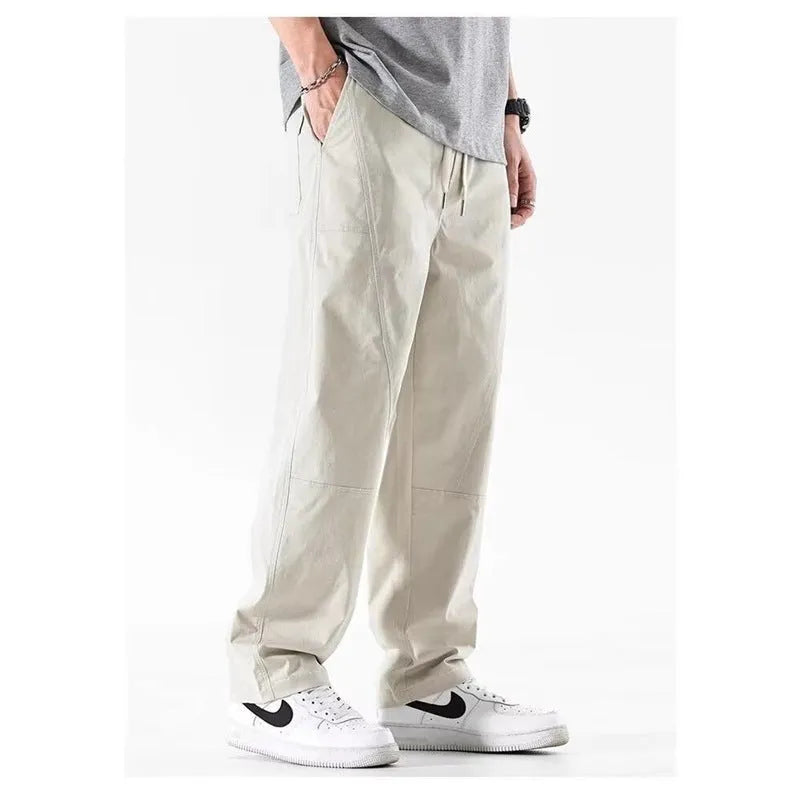 Cotton wide-leg casual trousers in milky white and black colours, showcasing the relaxed fit.