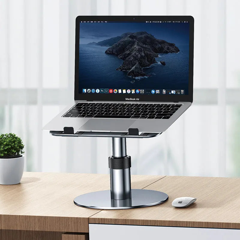 Adjustable silver aluminium car laptop stand with height settings and non-slip pads on a car seat.