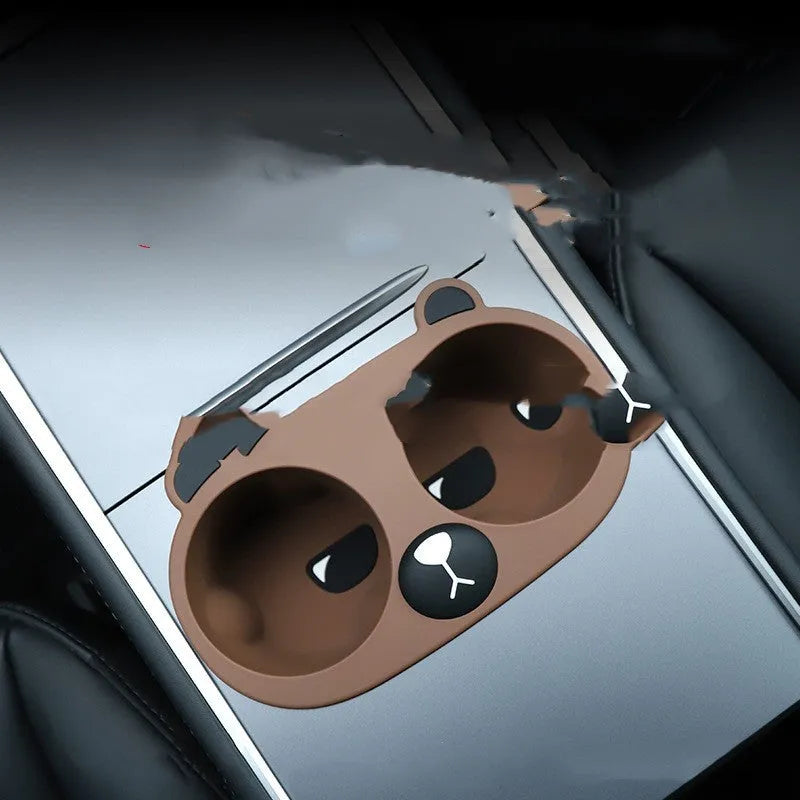Grey, tan, and pink silicone car cup holder limiter inserts for the centre console