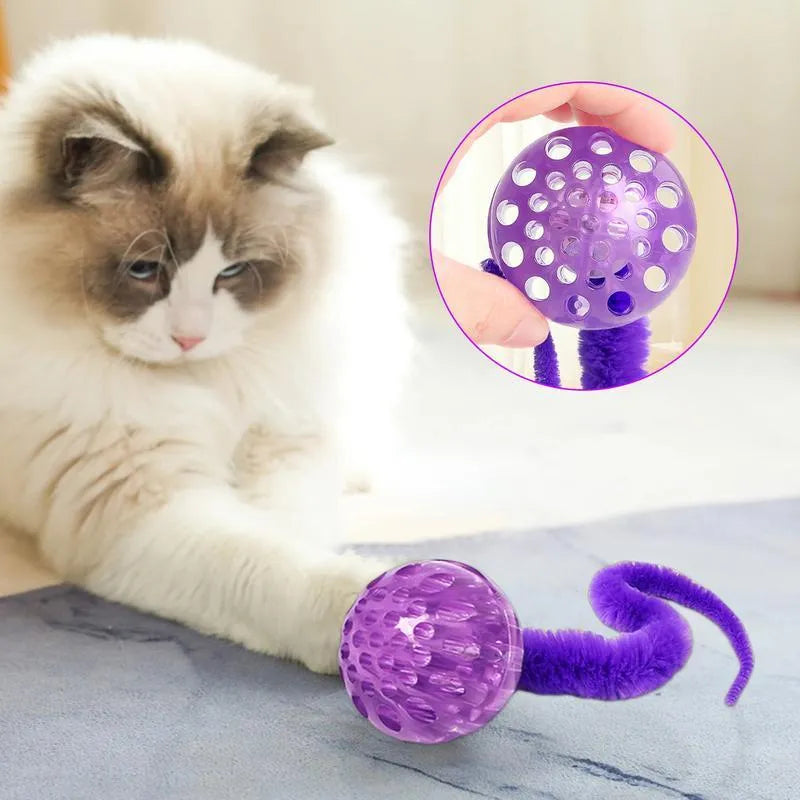 Green interactive bouncy ball cat toy with plush tail for indoor play