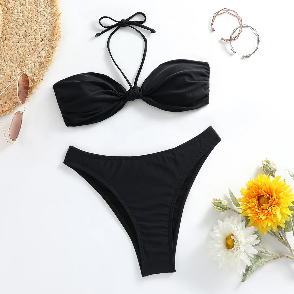 Black women's bikini set with lace-up tube top and matching briefs on mannequin