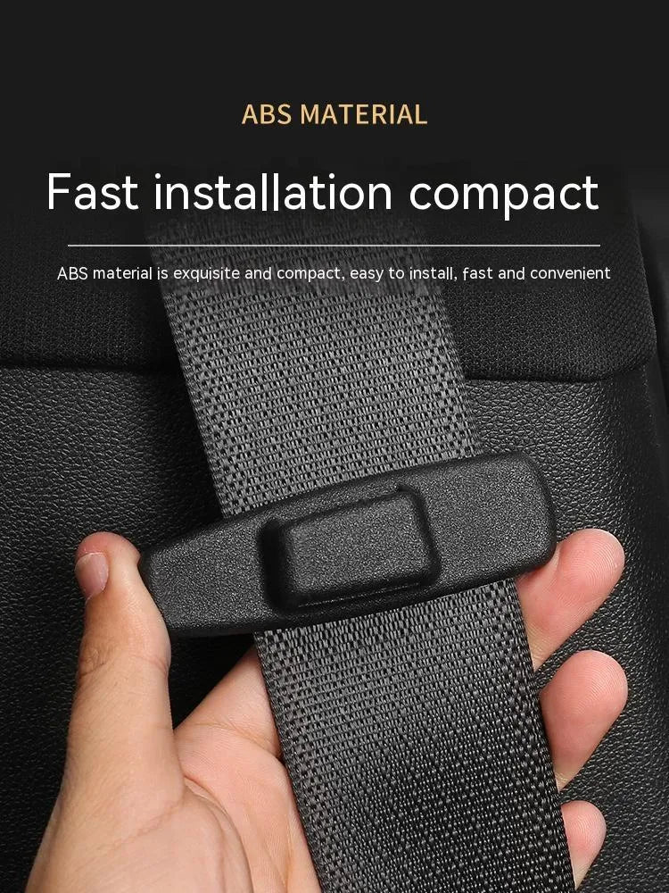 Black ABS plastic car seatbelt stopper clips preventing automatic retraction