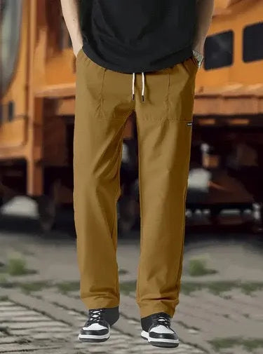 Men's light grey polyester casual trousers laid flat showing front design.