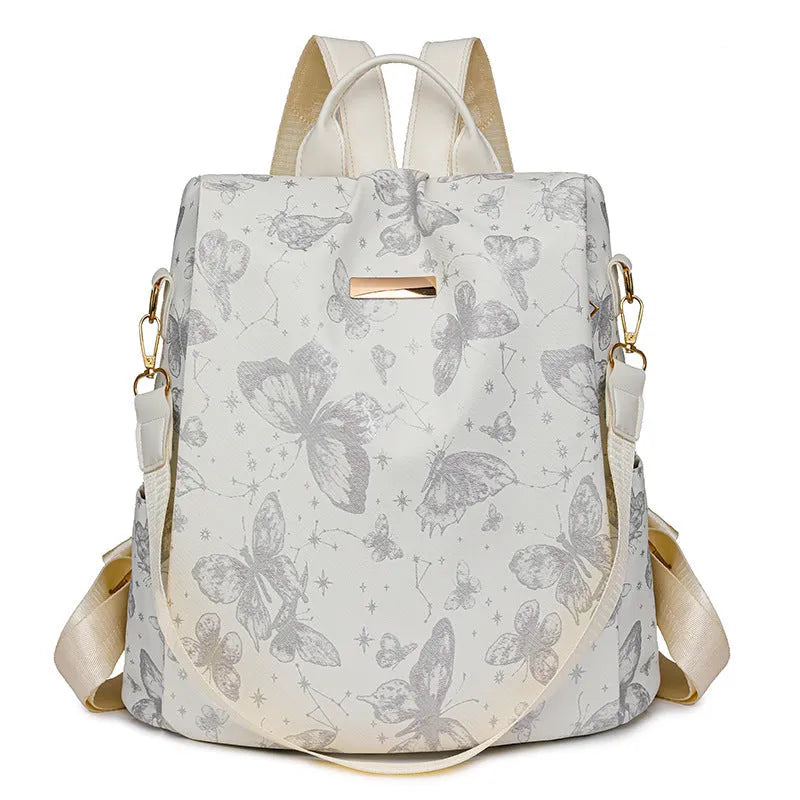 Butterfly print backpack with sewing line detail shown in multiple colour options