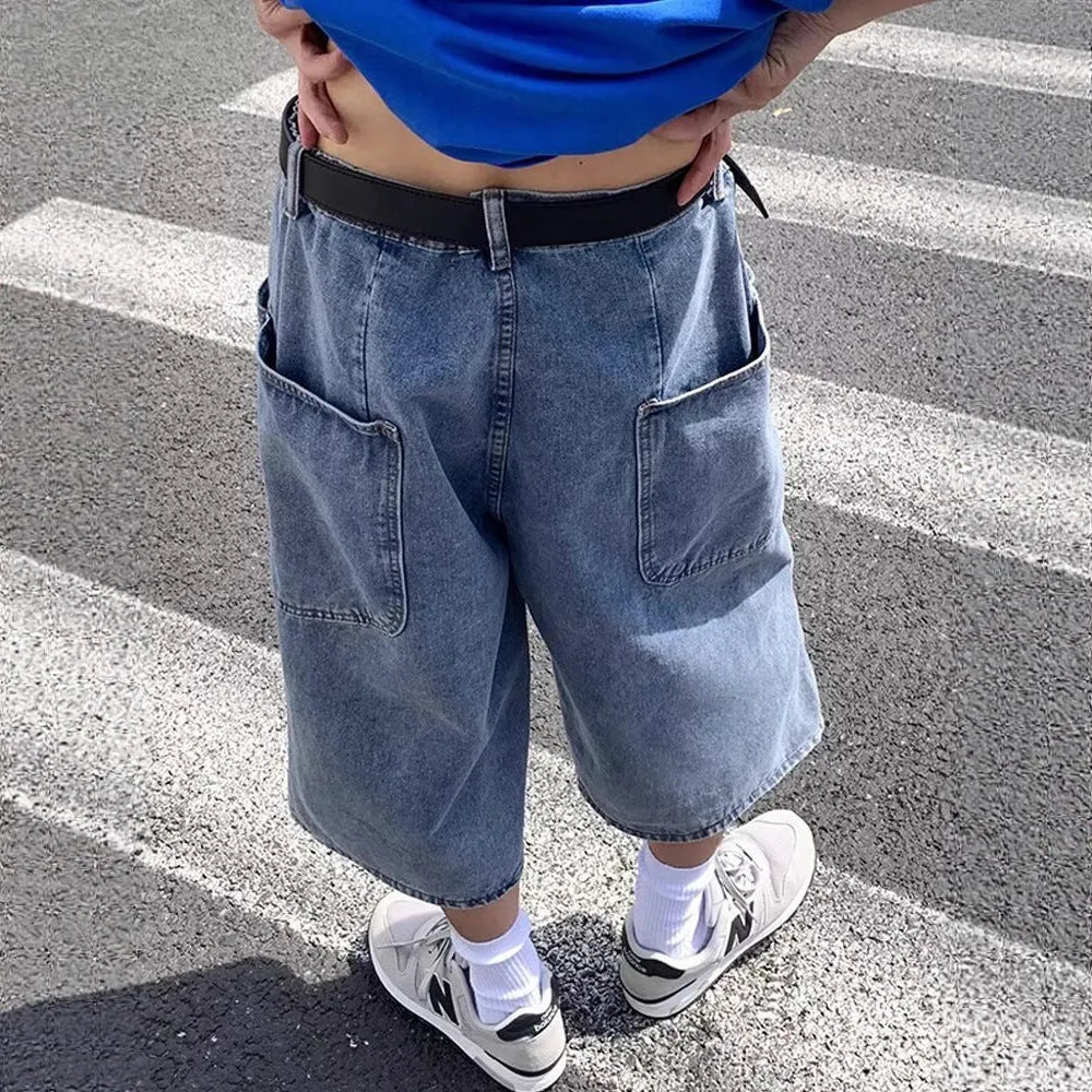 Blue washed denim shorts for men with a high waist, cropped length, and front zip fly.