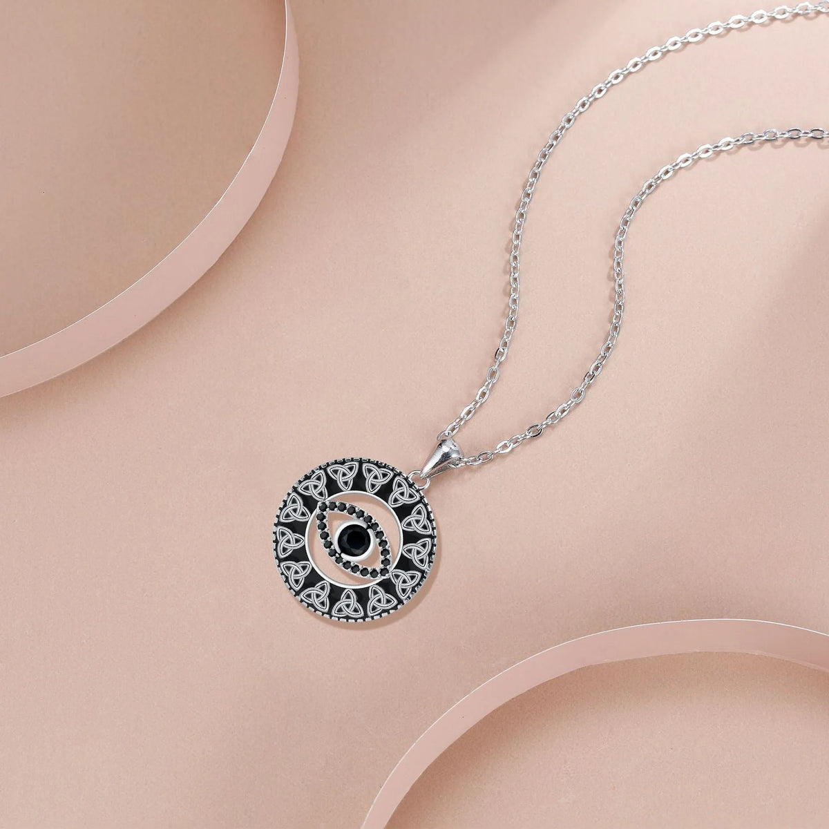 Copper Devil's Eye necklace with cross chain style pendant and electroplated finish.
