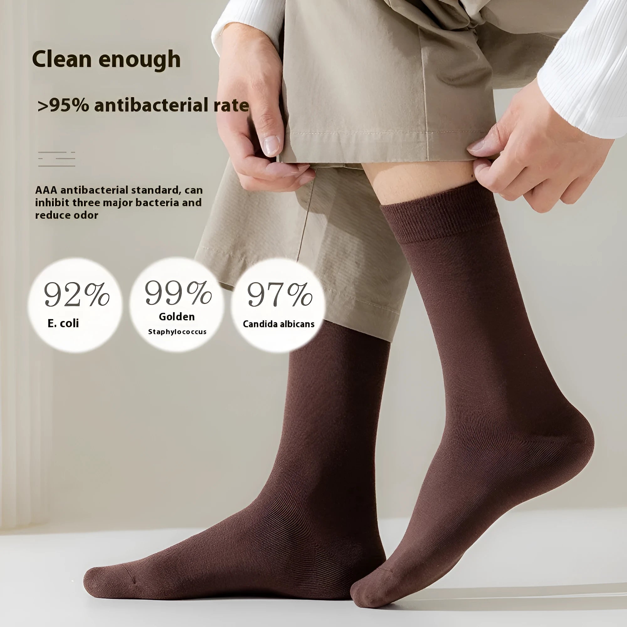 Men's solid colour mid-calf socks in combed cotton, shown in a range of neutral shades including beige, black, and dark blue.