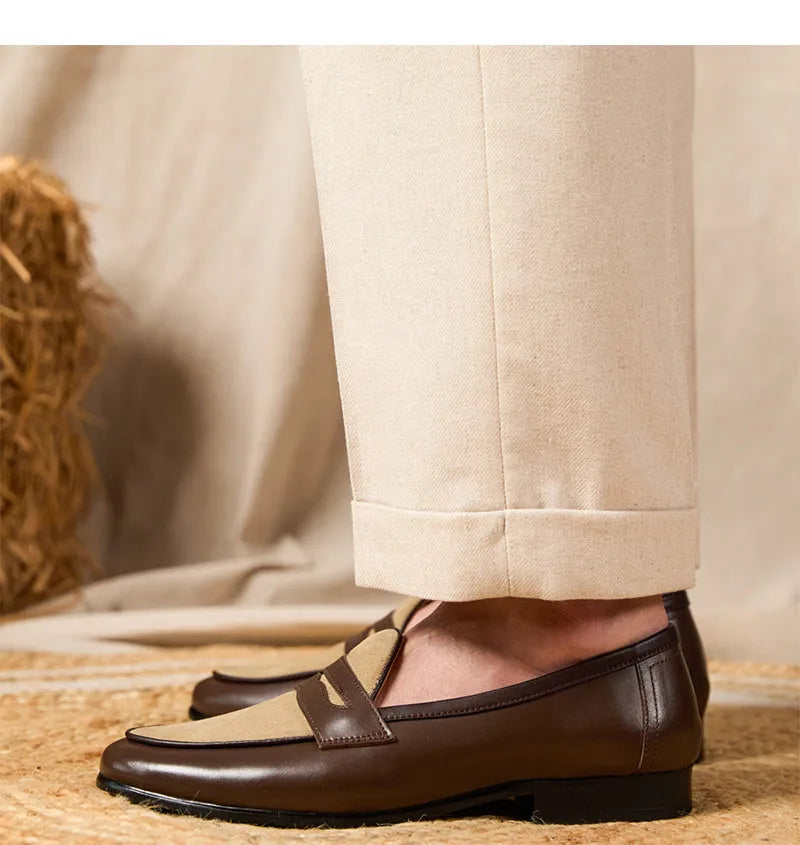 Coffee grey suede leather loafers with an elastic kick tab closure and a rubber sole.