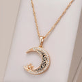 Rose gold star and moon zircon pendant necklace with enamel detail on a water wave chain.