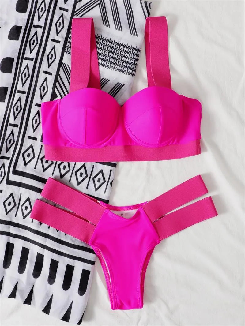 Women's rose red bikini swimsuit with steel wire push-up top and matching bottoms on a neutral background.