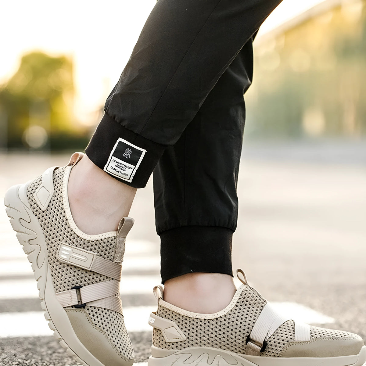 Men's grey safety shoes with steel toe caps, rubber soles, and flying woven upper construction