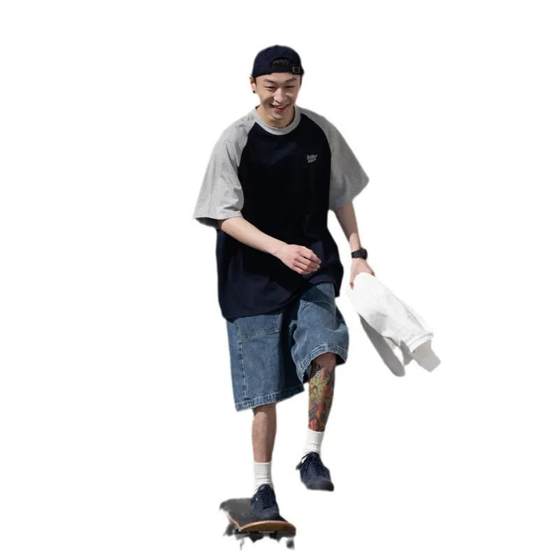 Blue casual men's t-shirt with raglan sleeves on a hanger, showing loose fit.