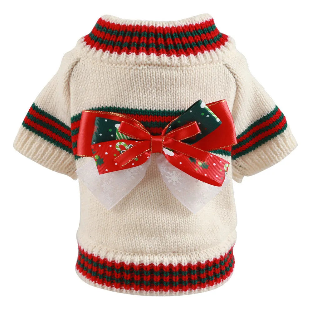 Red and green Merry Christmas design dog jumper on a small pet, showing the festive pattern and knit construction.