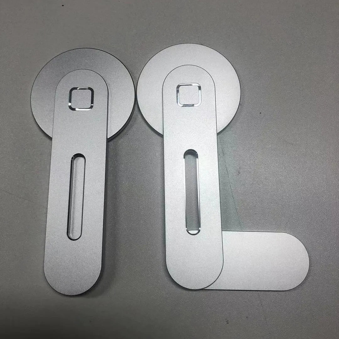 Aluminum alloy magnetic desktop expansion bracket for notebook computers, shown in silver finish.