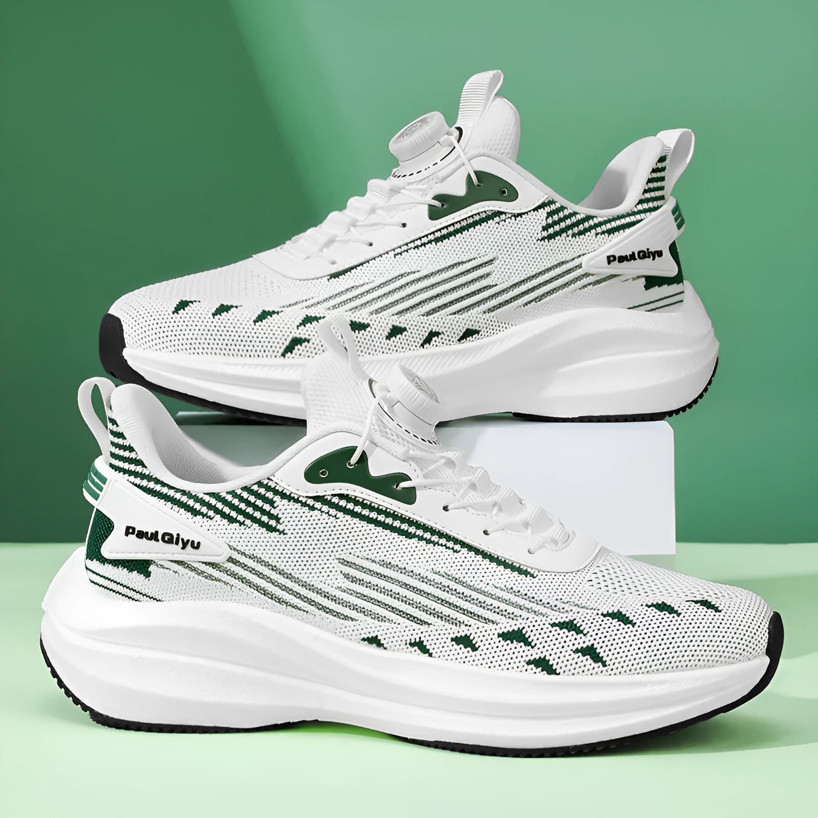 Men's white and green Fly-kit mesh running shoes with rotating buckle and TPU popcorn sole on a flat heel.