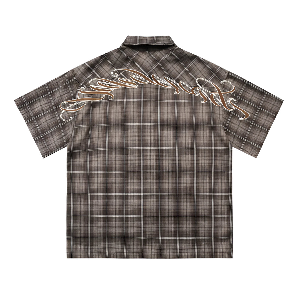 Men's black and brown plaid short sleeve shirt with embroidered lettering and lapel collar