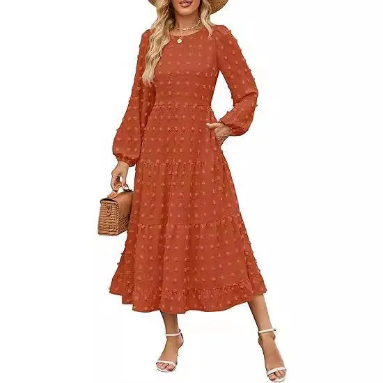 Beige women's high waist long sleeve dress with ruffle sleeves on a mannequin.