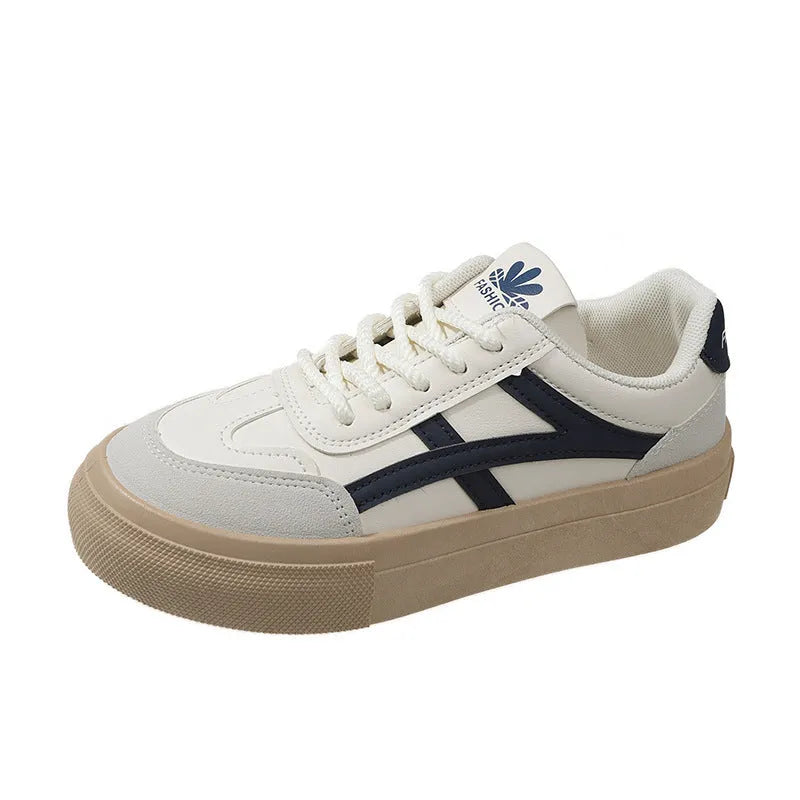 Blue and brown low-top lace-up board shoes with patent leather upper and flat rubber sole.