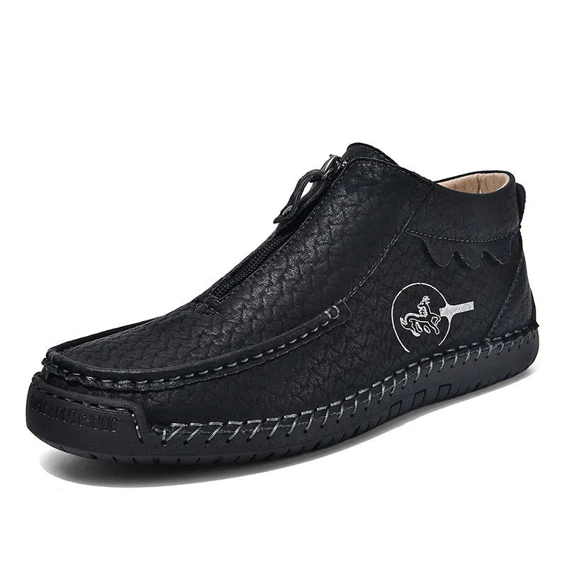 Men's black slip-on loafers with round toe and flat rubber sole on a white background.