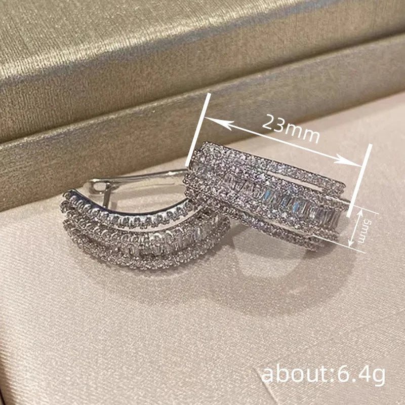 Geometric white gold colour zircon stud earrings with inlaid stone settings on copper