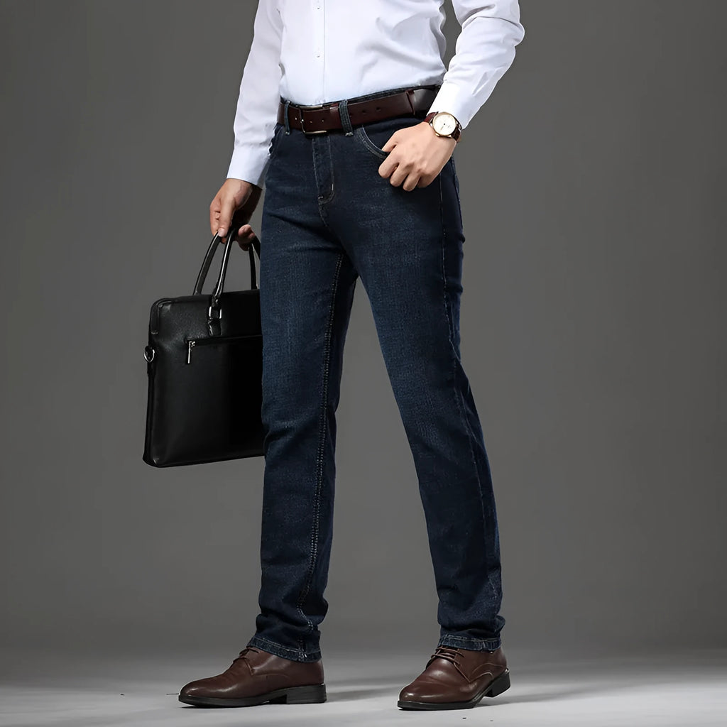 Men's black and blue stretch denim jeans showing straight-leg business casual style with mid waist and zip fly