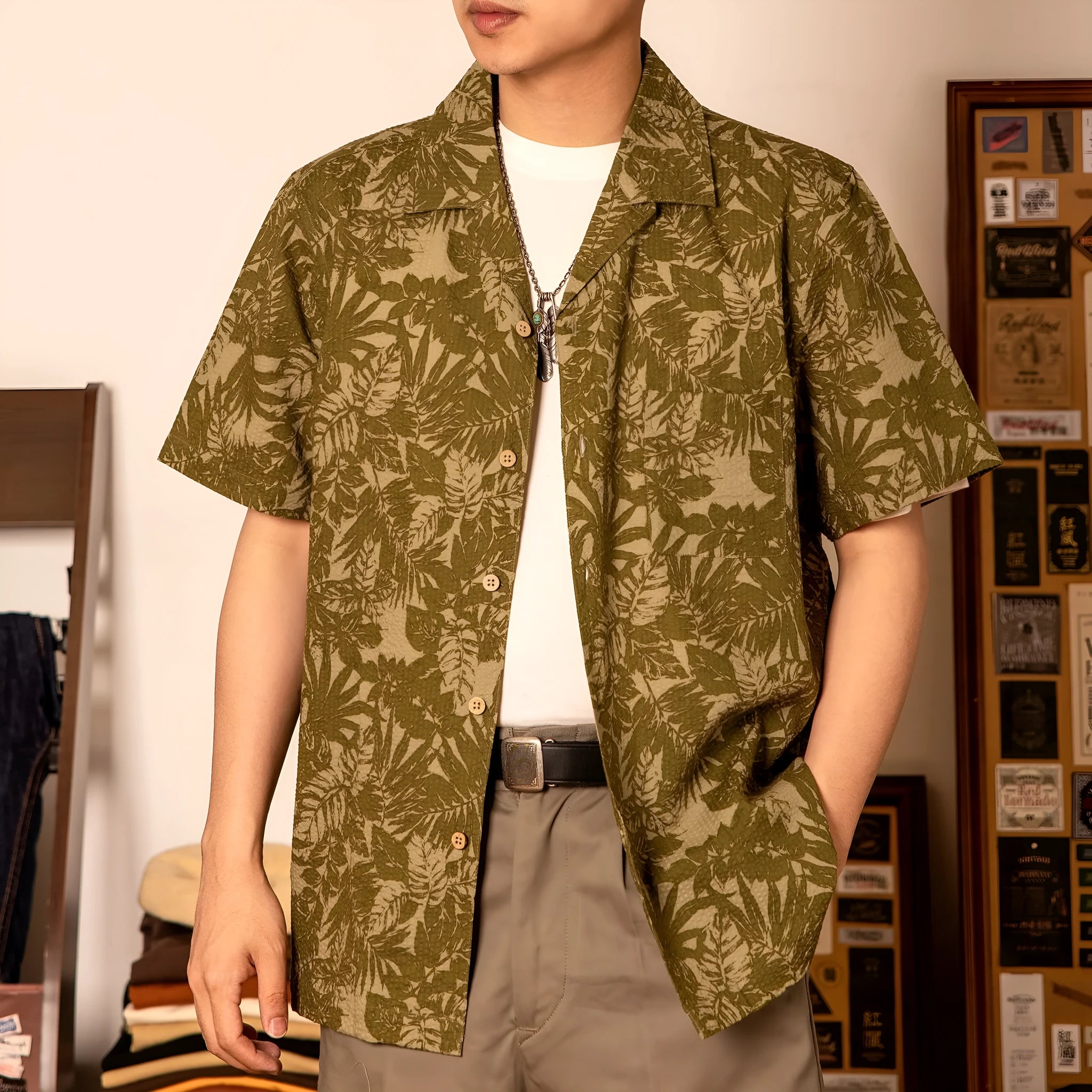 Vintage floral print seersucker shirt with a Cuban collar on a mannequin, showing loose cardigan fit.