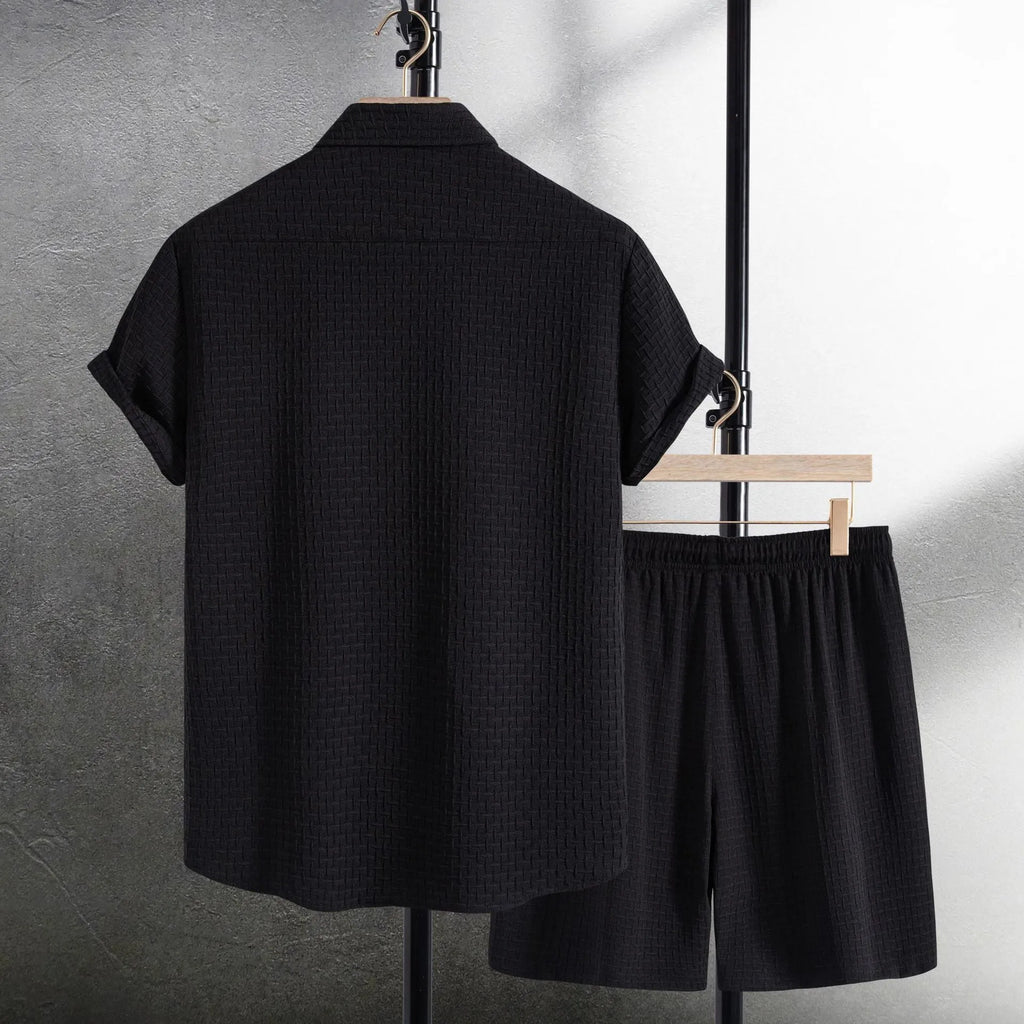 Men's loose fit cotton blend beach suit with short sleeve shirt and shorts in black.