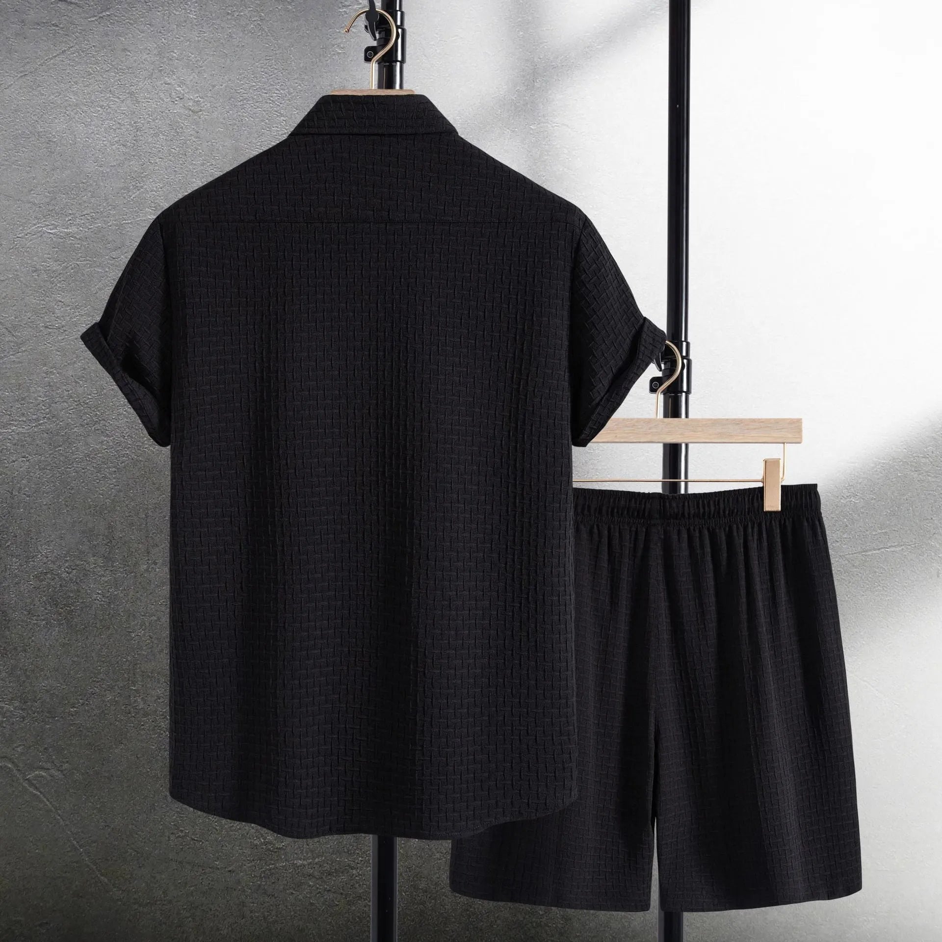 Men's loose fit cotton blend beach suit with short sleeve shirt and shorts in black.